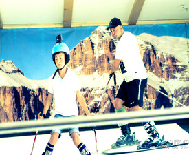 Individual snowboarding on an indoor track
