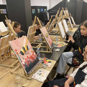 Art therapy for children with colorful paint and a brush in hand